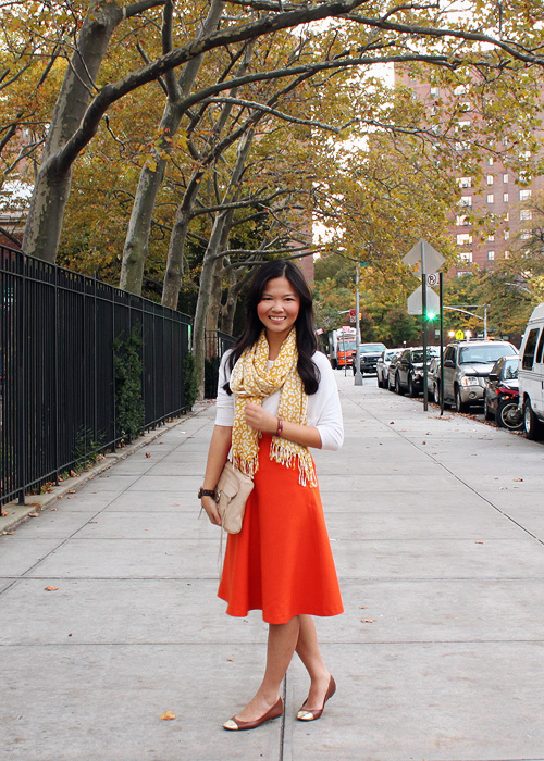 Jenny in Jacquard; NYC fashion blogger; style blog; fall outfit photos; Halloween inspired outfit; Topshop cream sweater top; Banana Republic yellow leopard scarf; H&M orange a-line skirt; H&M gold captoe brown flats; Michael Kors tortoise boyfriend watch; Rebecca Minkoff nude beige MAC clutch