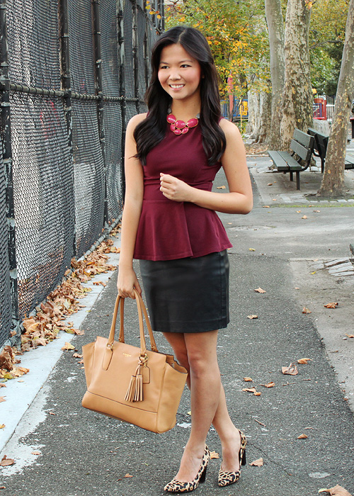 Jenny in Jacquard; NYC fashion blogger; style blog; outfit photo; Topshop oxblood maroon burgundy peplum top; Express black faux leather skirt; David Aubrey necklace; DVF Diane von Furstenberg leopard April heels; Coach Candace carryall tote in camel
