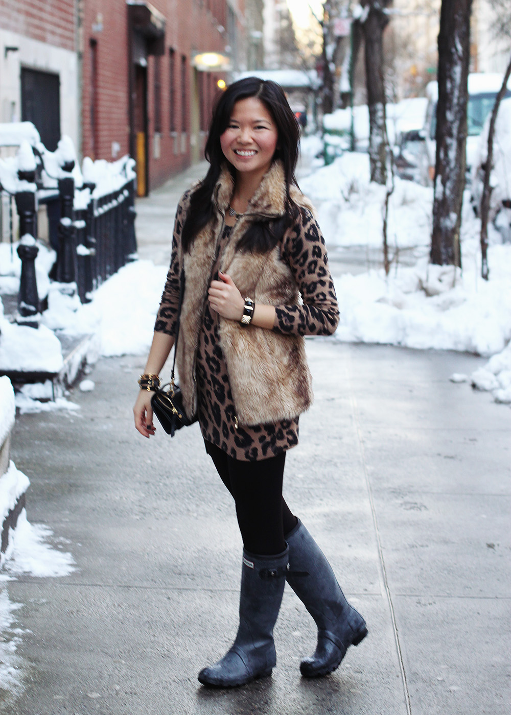 Skirt the Rules; NYC fashion blogger; style blog; winter outfit photos; Banana Republic black wool coat; Zara Girls faux fur vest; Old Navy leopard sweater dress; Uniqlo HeatTech leggings; Hunter shearling lined rain boots; Sequin geometric necklace; C. Wonder skinny cuffs; Juicy Couture pave pyramid bracelet; DVF black crossbody bag