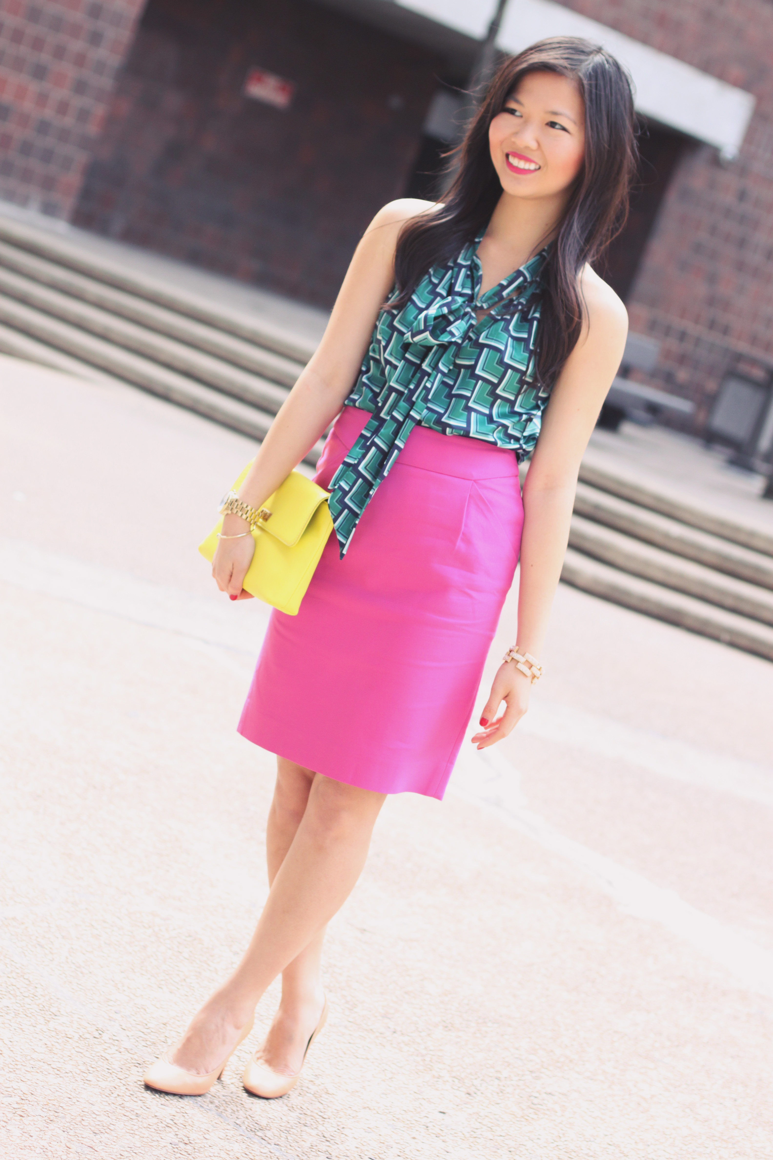 Skirt The Rules Blog; NYC fashion blogger; style blog; spring outfit photos; Banana Republic Factory turquoise print bow blouse; J.Crew Factory Pencil Skirt in Double Serge Cotton; J.Crew Pave Square Link Bracelet; Michael Kors gold mother of pearl boyfriend watch; J.Crew Factory Vero Clutch in neon yellow; Pour La Victoire Mai wedge pump