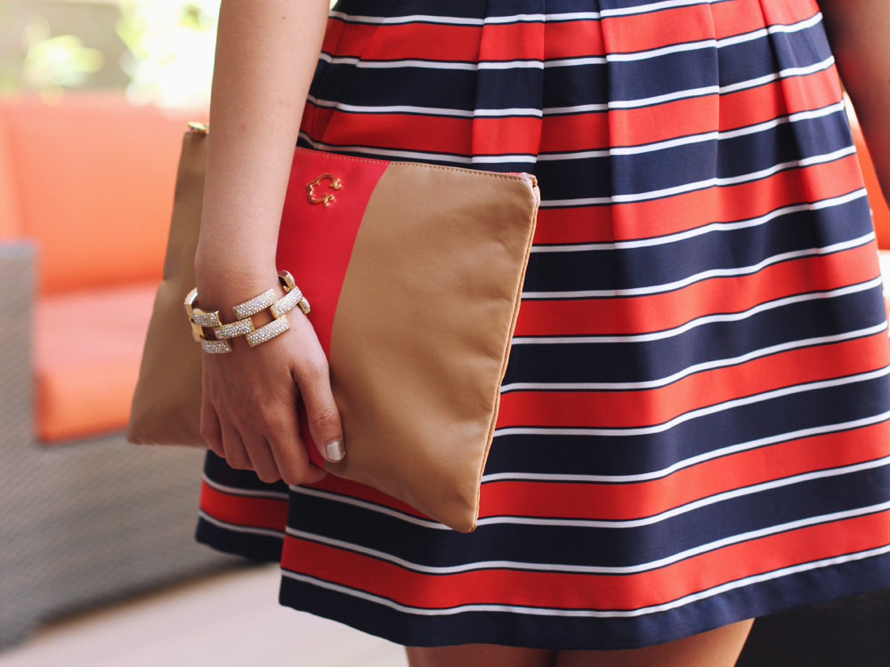 Skirt The Rules Blog; NYC fashion blogger; style blog; fall outfit photos; Banana Republic dark chambray denim shirt; J.Crew Factory red and navy striped skirt; J.Crew square pave link bracelet; C. Wonder camel and red striped clutch; H&M gold brown captoe shoes