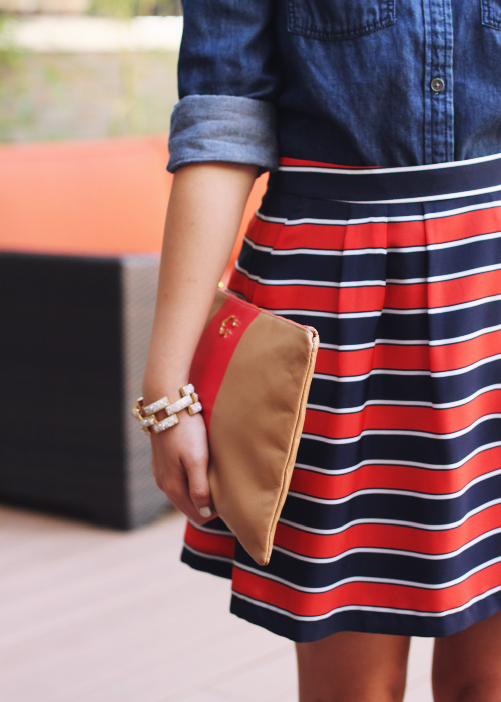 Skirt The Rules Blog; NYC fashion blogger; style blog; fall outfit photos; Banana Republic dark chambray denim shirt; J.Crew Factory red and navy striped skirt; J.Crew square pave link bracelet; C. Wonder camel and red striped clutch; H&M gold brown captoe shoes