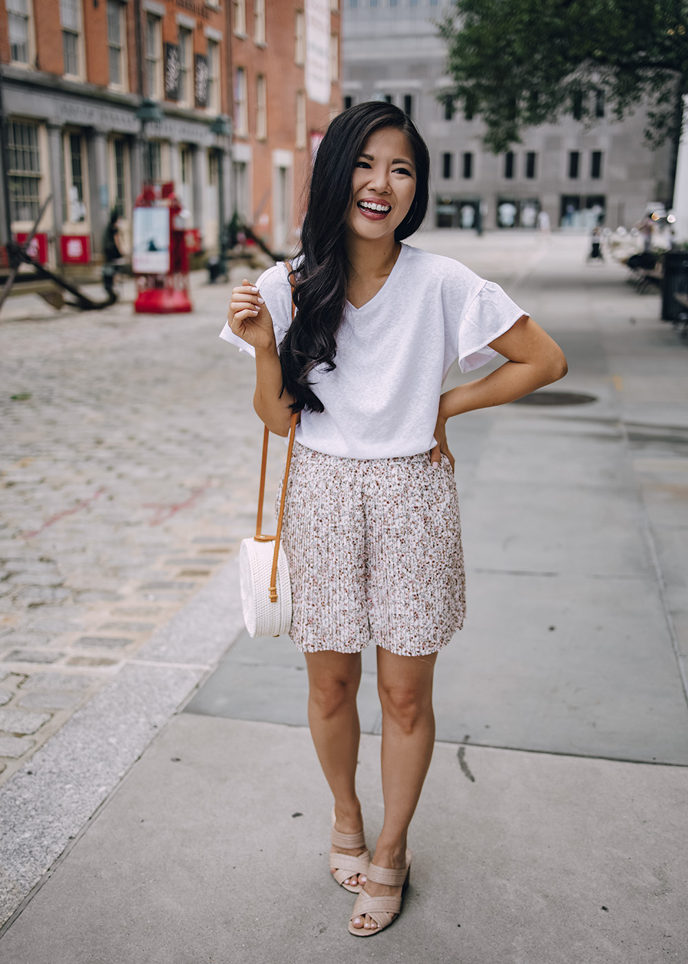 Casual Summer Outfit Ideas for Women: White Ruffle T-Shirt and Floral Shorts